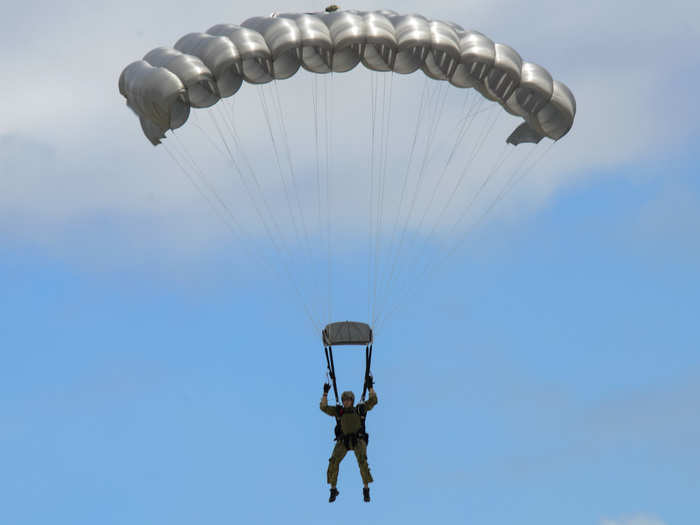 Naval Special Warfare Unit 1, under which 4 SEAL teams are grouped, is also stationed at the naval base. Below is a sailor from the unit performing a free fall parachute in Guam.