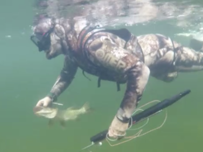 Later, he puts on a wet suit and goes spearfishing. After he spears a lunker, the camera follows him underwater for about 2 minutes as he swims back to the boat with his prize.