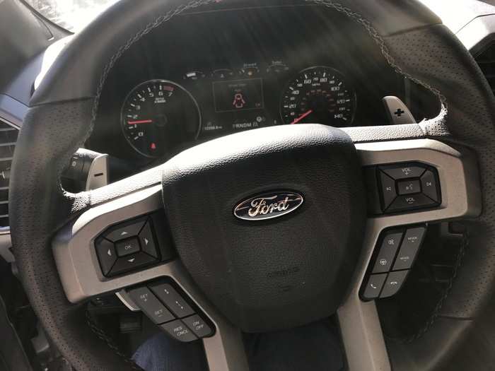A lot going on with the steering wheel, in terms of controlling vehicle functions. And if you look behind the wheel there are paddle shifters! And they