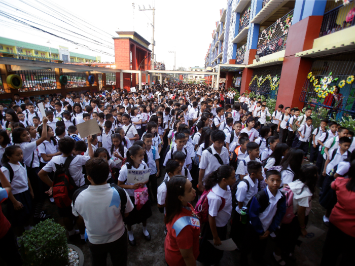 Philippines: Filipino students line up during the first day of school at the President Corazon C. Aquino Elementary School in suburb north of Manila.