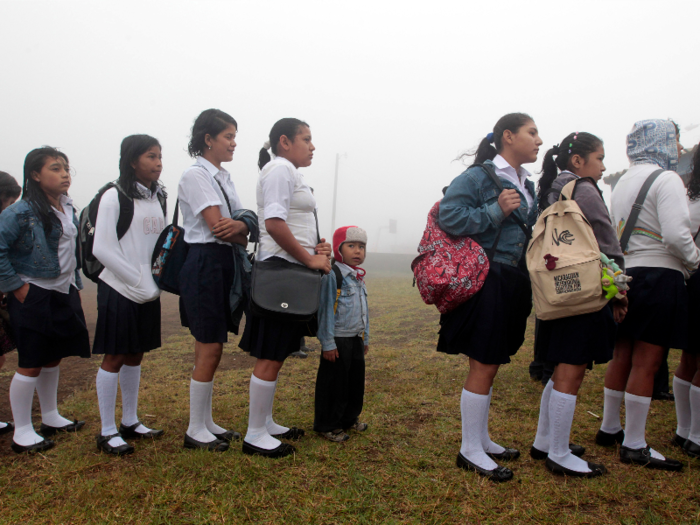 Nicaragua: Students wait in line to enter to their classroom on the first day of school in Managua.