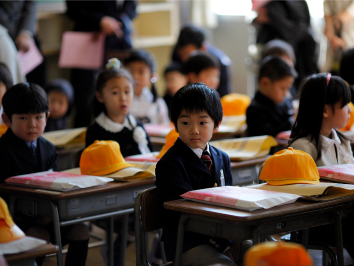 Japan: Children sit inside a classroom at Shimizu elementary school in Fukushima.