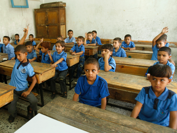 Gaza Strip: Palestinian children sit inside a classroom on the first day of school at al-Shafi