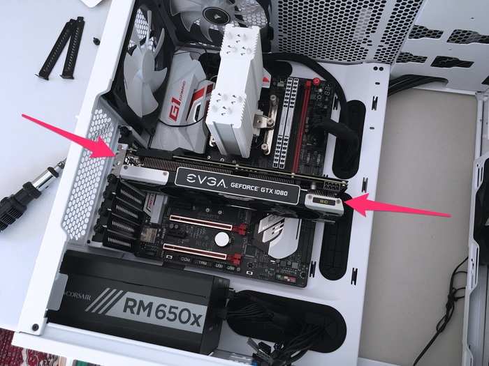 I fit the graphics card into its designated slot, right underneath the CPU cooler.