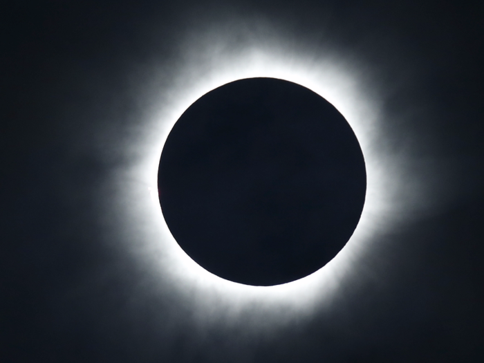 Totality begins when the moon makes its second contact with the sun and entirely blocks it out. The view is about as bright as a full moon, and it