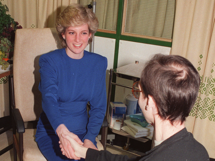 She famously became a major advocate for AIDS patients. She was photographed shaking patients