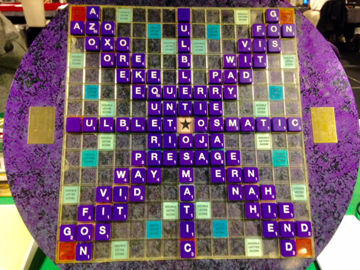 One of the tournament directors, Daniel Stock, kept players entertained between rounds by crafting linguistic works of art like the one below. Each of his masterpieces uses all 100 tiles and contains only words that are Scrabble-acceptable.