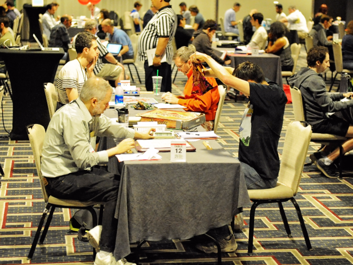 As the first day of competition got underway, the room was nearly silent, save for the sound of thousands of rattling plastic Scrabble tiles.