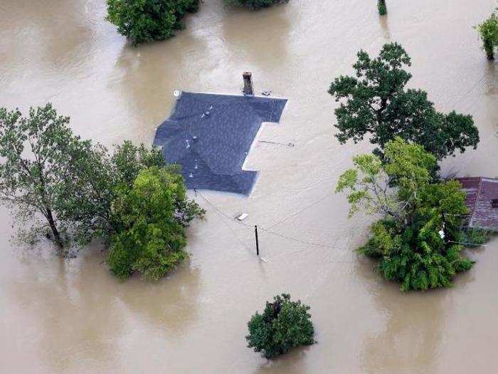 Some homes, like this one in Houston, were covered up to their roofs on Tuesday.