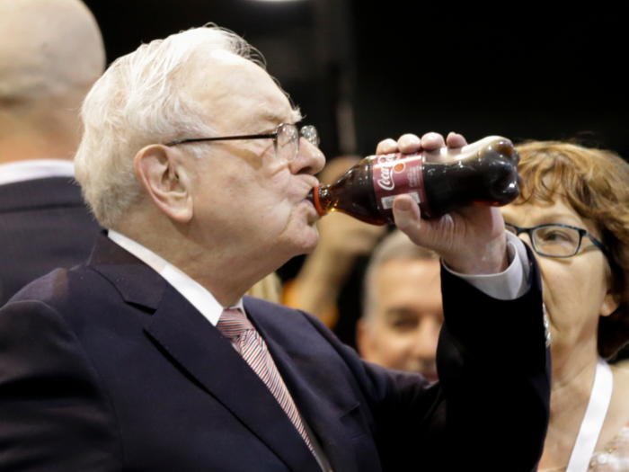 He then washes down the fast food with some Coke. Buffett usually drinks about five cans of Coke a day. Berkshire Hathaway also owns stock in Coca-Cola.