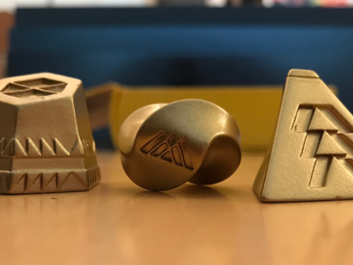 The metal pieces are very interesting when you view them up-close. The markings on each piece signify a different discipline you can choose for your Guardian (your character). From left, the pieces symbolize the titan, warlock, and hunter disciplines.