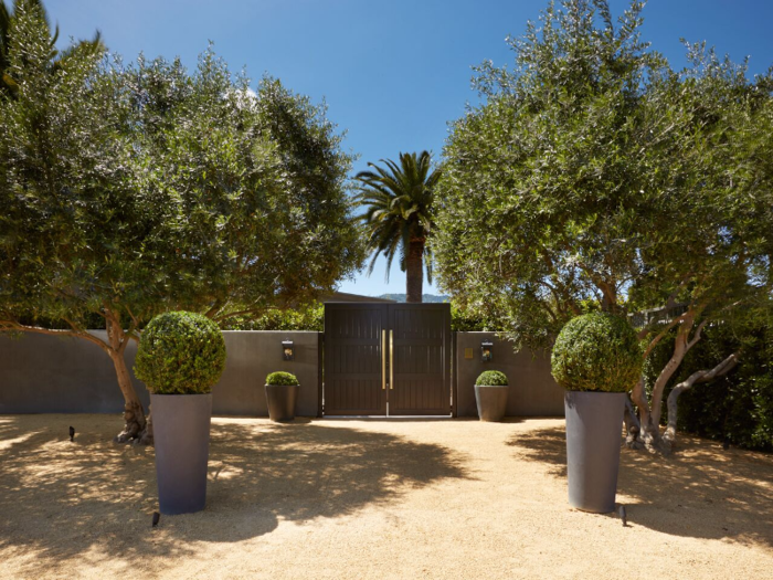 These eight-foot black gates are complete with brass hardware, and they make for a dramatic entrance to the estate.