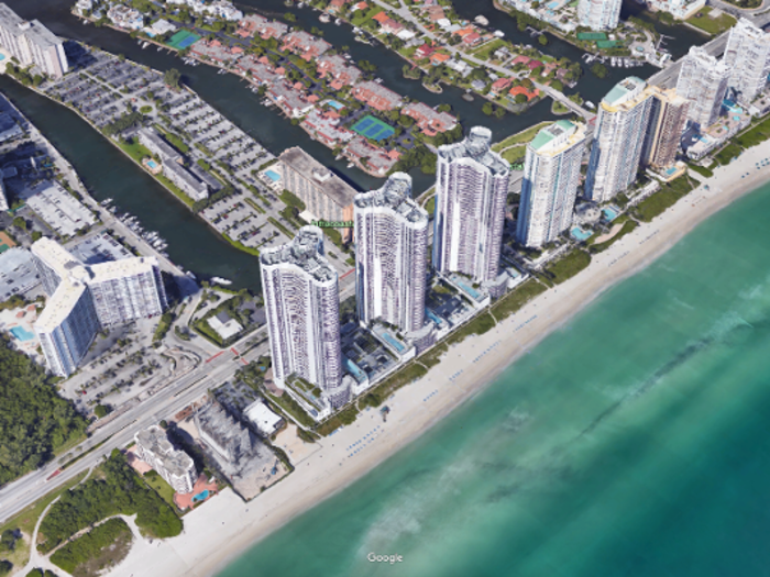 The Trump Towers are three nearly identical pillars located on the edge of the quaint seaside community of Sunny Isles Beach, Florida. They contain 813 luxury condo units.