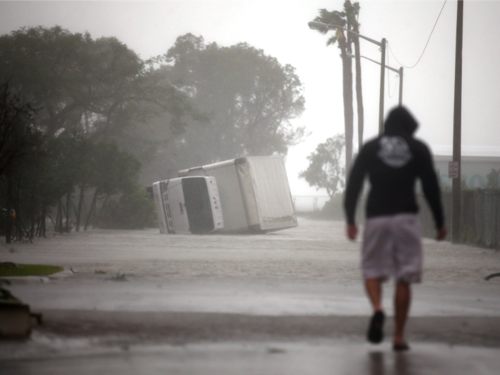 The winds and floodwaters were strong enough to topple this large truck in Miami.