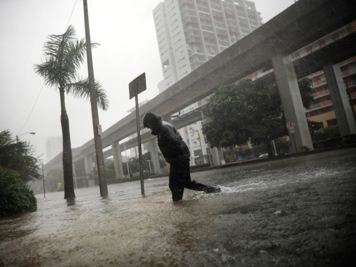 The worst of the storm was seen on Sunday, when Floridians had to wade through flooded streets, like this one in downtown Miami.