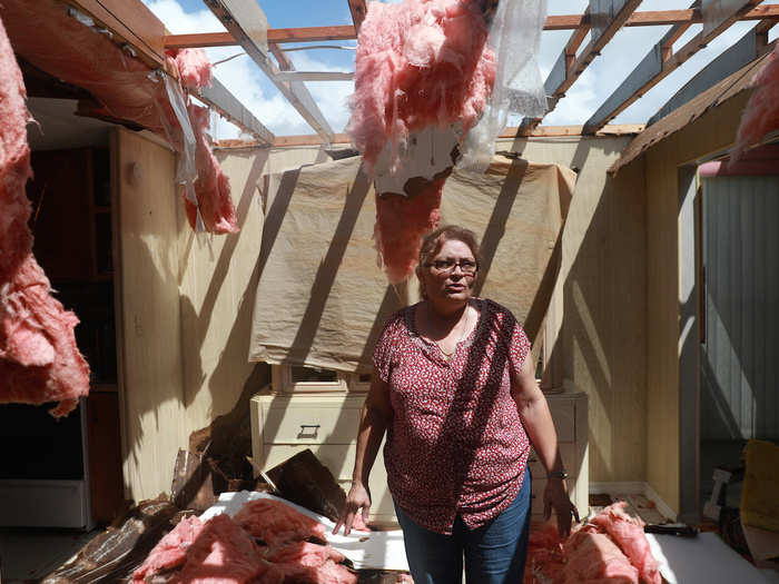 Maida Esteves, one of the residents of the mobile home park, stood in what was once her living room on Monday after Irma destroyed her home.