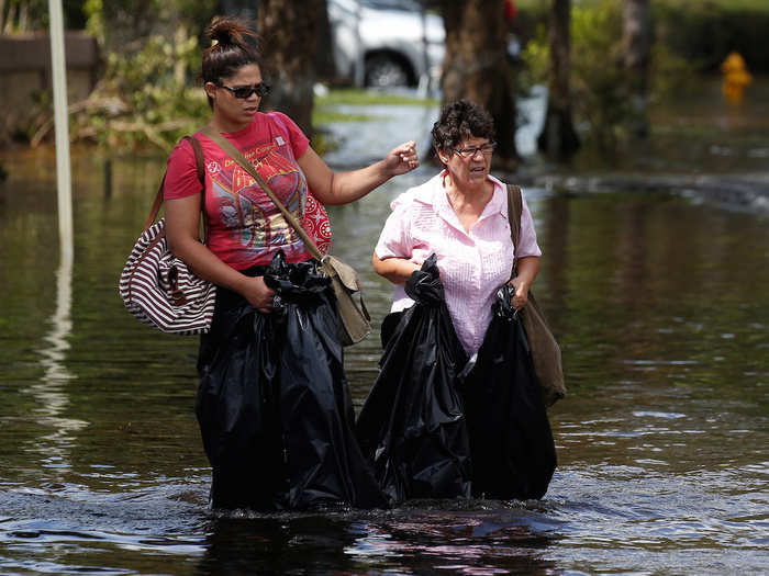 Streets flooded all along the coast and in North Miami, forcing people to flee their homes with garbage bags.