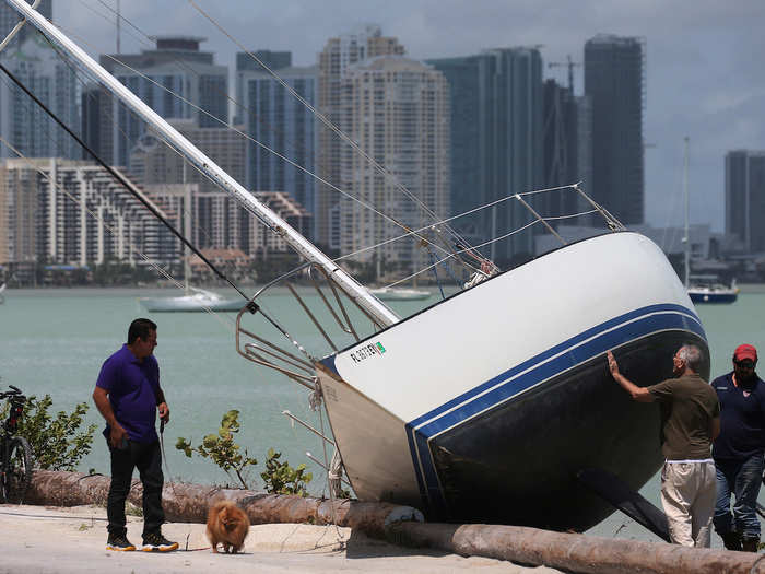 Some 6.3 million people in Florida were ordered to evacuate before Irma made landfall, according to the Florida Division of Emergency Management. With winds of up to 70 mph, the storm overturned boats, like this one seen in Biscayne, Florida on Monday.