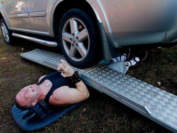 In what was perhaps one of the most physically painful world record attempts, Attila Banyai let a four-wheel drive vehicle roll over him during a festival near Budapest, Hungary.