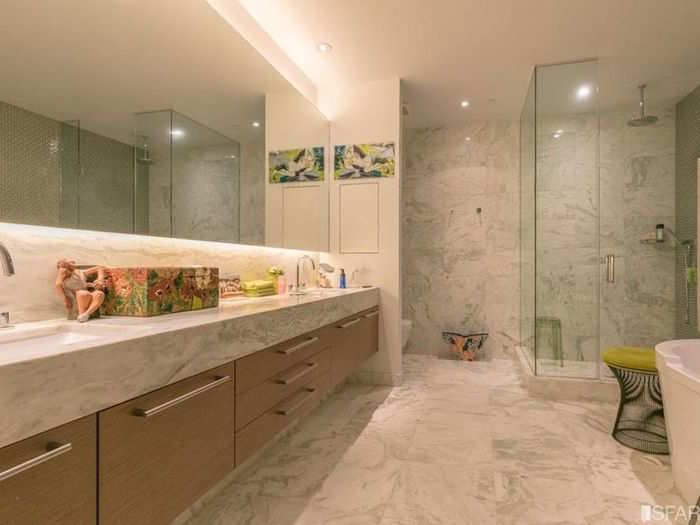 A dreamy master bath offers a soaking tub and a separate shower.