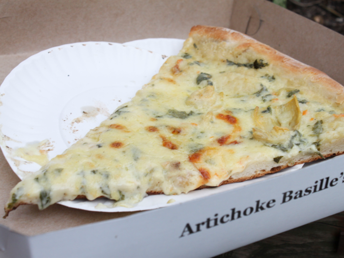 The pizza is smothered in cheese, spinach and artichoke. The pizza oozes and drips everywhere while eating it but the taste is well worth the mess.