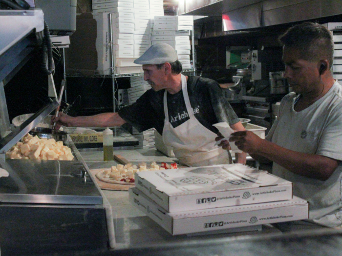 Every pizza is made and baked right in front of the customers. If someone only orders a slice, that slice is then warmed up in the stone oven before serving to ensure everyone is satisfied.