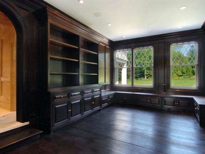 Custom design and hand-milled woodwork are visible throughout the house. The bathrooms are sculpted with marble from Verona, Italy, according to the listing.