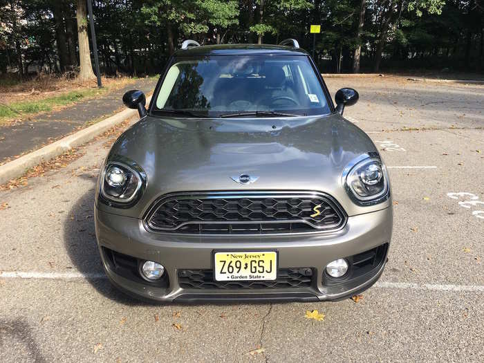 ...Massive, roundish headlights and blacked-out grille...