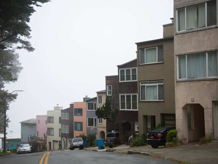 I set off down a residential street and admired the houses, which looked like faded LEGO bricks standing upright on a hill. Street parking was plentiful. Some homes had yards.