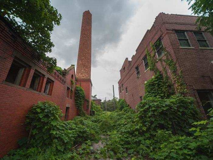 One of the first buildings I saw was the morgue (right). The fractured chimney of a coal-fired boiler room (left) is also visible from miles away.