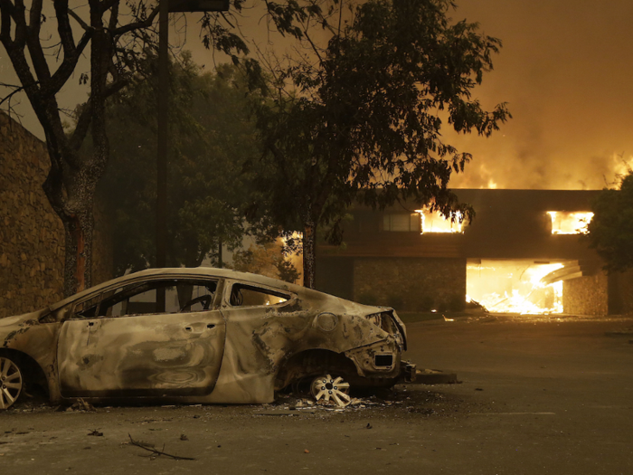 The flames lurched past its walls and destroyed everything in its path, leaving only a crooked steel frame, pieces of stone walls, a dry fountain, and two wooden tables intact.