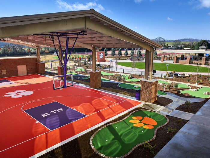 Outside, there is a basketball court and a putting green.