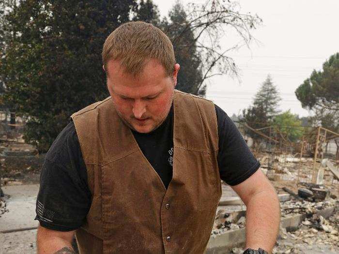 Luke Baier salvaged a block of concrete that he and his brothers left their handprints on as children. There was little else left of his house.