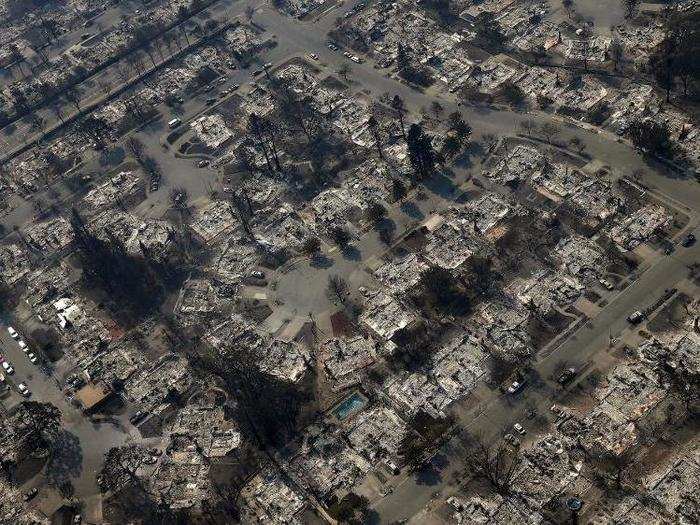 Aerial photos taken in the days after the fire show hundreds of homes turned to rubble.