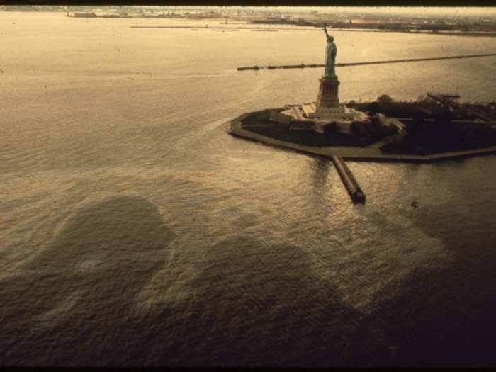 In the first six months of 1973, more than 300 oil spills occurred in the New York City area. An oil slick creeps up on the Statue of Liberty in this 1973 photo.