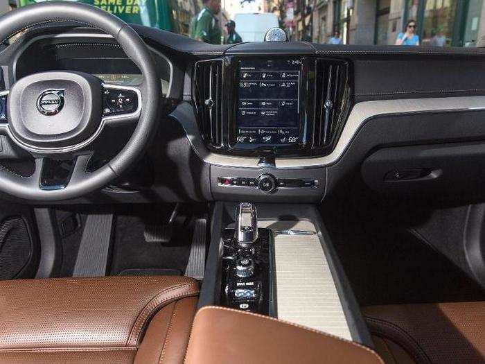 The front cockpit is roomy and defined by the large center touchscreen running Volvo