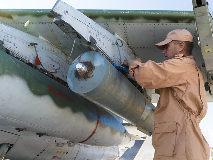 This shows a Russian airmen fixing a RBK-500 cluster bomb to an Su-25 in Syria in 2015.