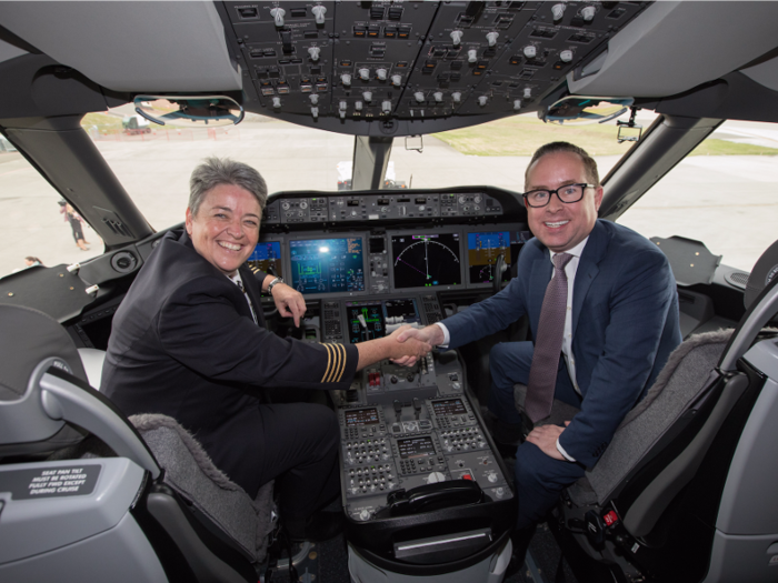 Shortly after everyone settles in and polished off a glass of bubbly, the flight departs. The Dreamliner powers effortlessly down the runway with Captain Lisa Norman at the controls, seen here with Qantas CEO Alan Joyce.