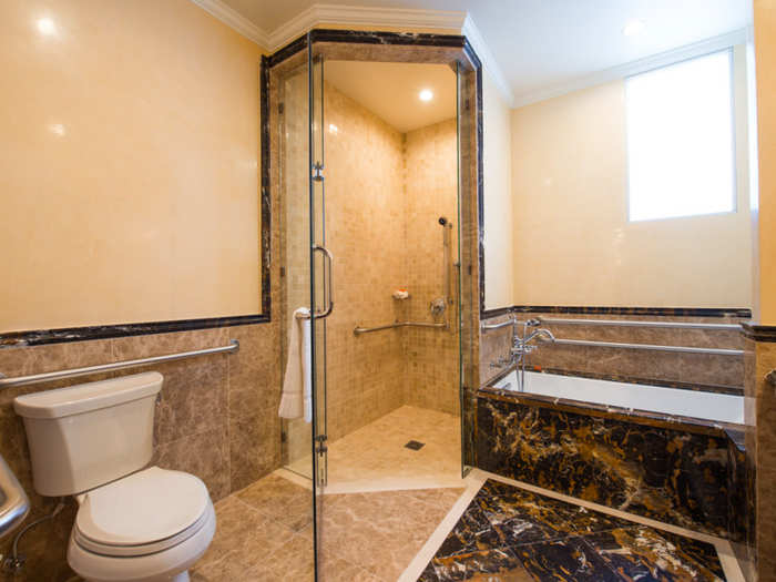 The private bathrooms feature exquisite marble.