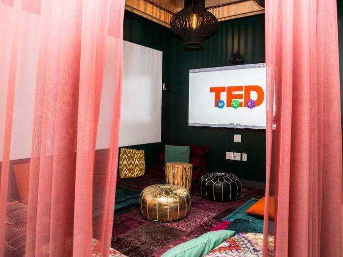 One workspace doubles as a viewing tent, complete with rugs, cushions, and poufs — all to view the talks going on in the amphitheater if it starts to overflow.