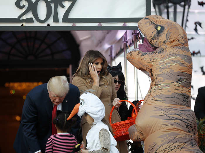 The first lady appeared surprised by one of the costumes ...