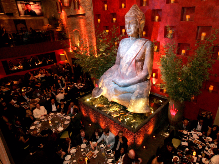 Upon entering, guests are greeted with a 20-foot Buddha statue, which seemingly floats upon an infinity pool filled with Japanese Ko.