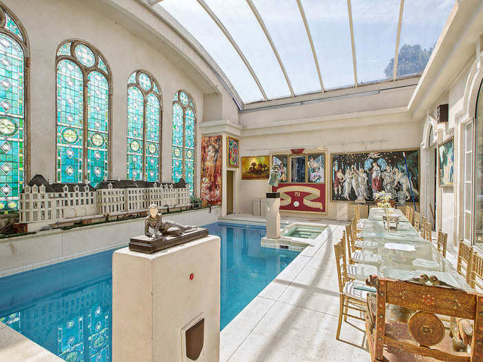 In the penthouse, stained glass windows salvaged from the former Little Sisters of the Poor Church reflect and sparkle off a 12-foot-by-20-foot indoor swimming pool.