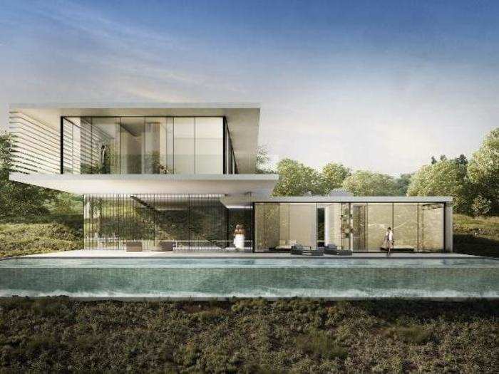 Axelrod Architects designed a 5,000-square-foot home comprised of a "glass box floating above the ground with minimal impact on the land below," according to the architect.