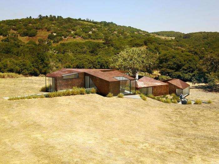 The home concept features 360-degrees views out its floor-to-ceiling windows. The asymmetrical rooflines are intended to be a reflection of the geography, according to the architect.