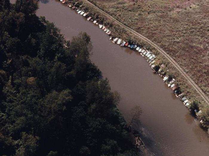 Near Cleveland, residents placed old cars along the Cuyahoga River