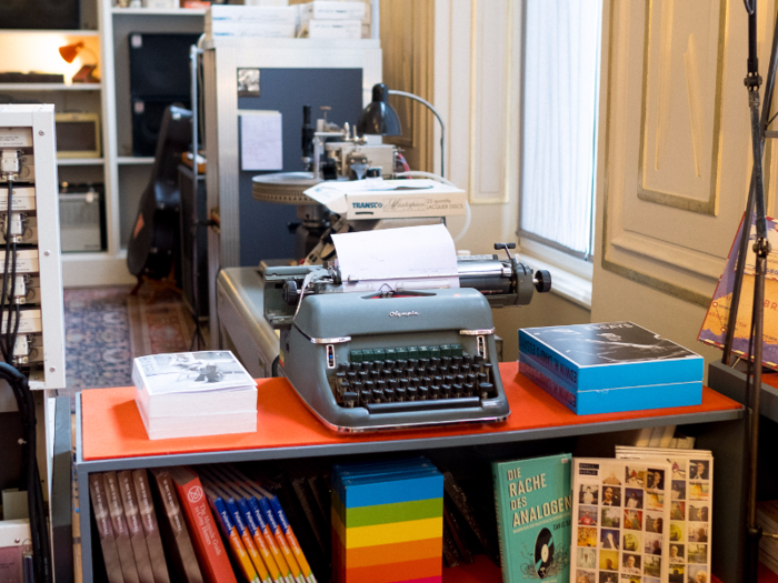 There are a lot of working typewriters around the store already loaded with paper.