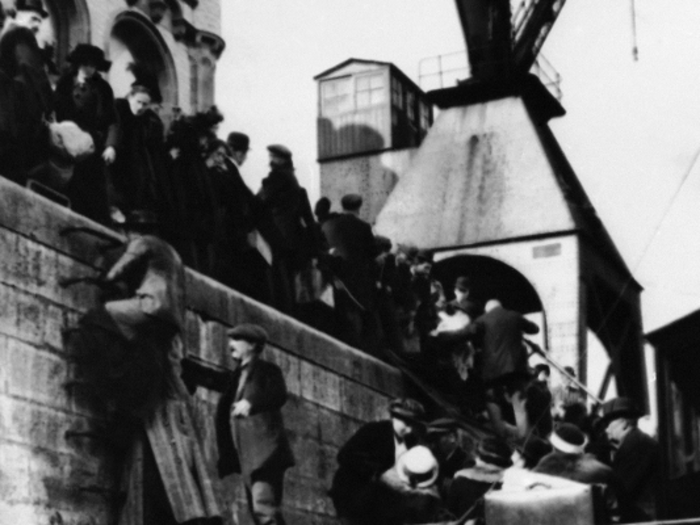 Caught between the advancing armies, civilians in Europe and elsewhere paid an enormous toll during the war. In this undated photo, Belgian refugees load onto boats in the port of Antwerp to escape the fighting in their country.