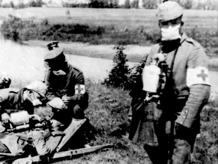 As the war progressed, previously unseen industrial weapons of war entered the conflict. This undated photo shows a German medic relieving victims of a gas attack.