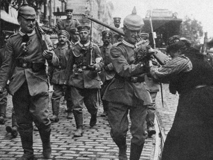 World War I officially began on July 28, 1914, after all the great powers of Europe formed two camps and issued declarations of war. Here, German soldiers leave Berlin for the Western Front on August 1, 1914, while women present them with flowers in gratitude.